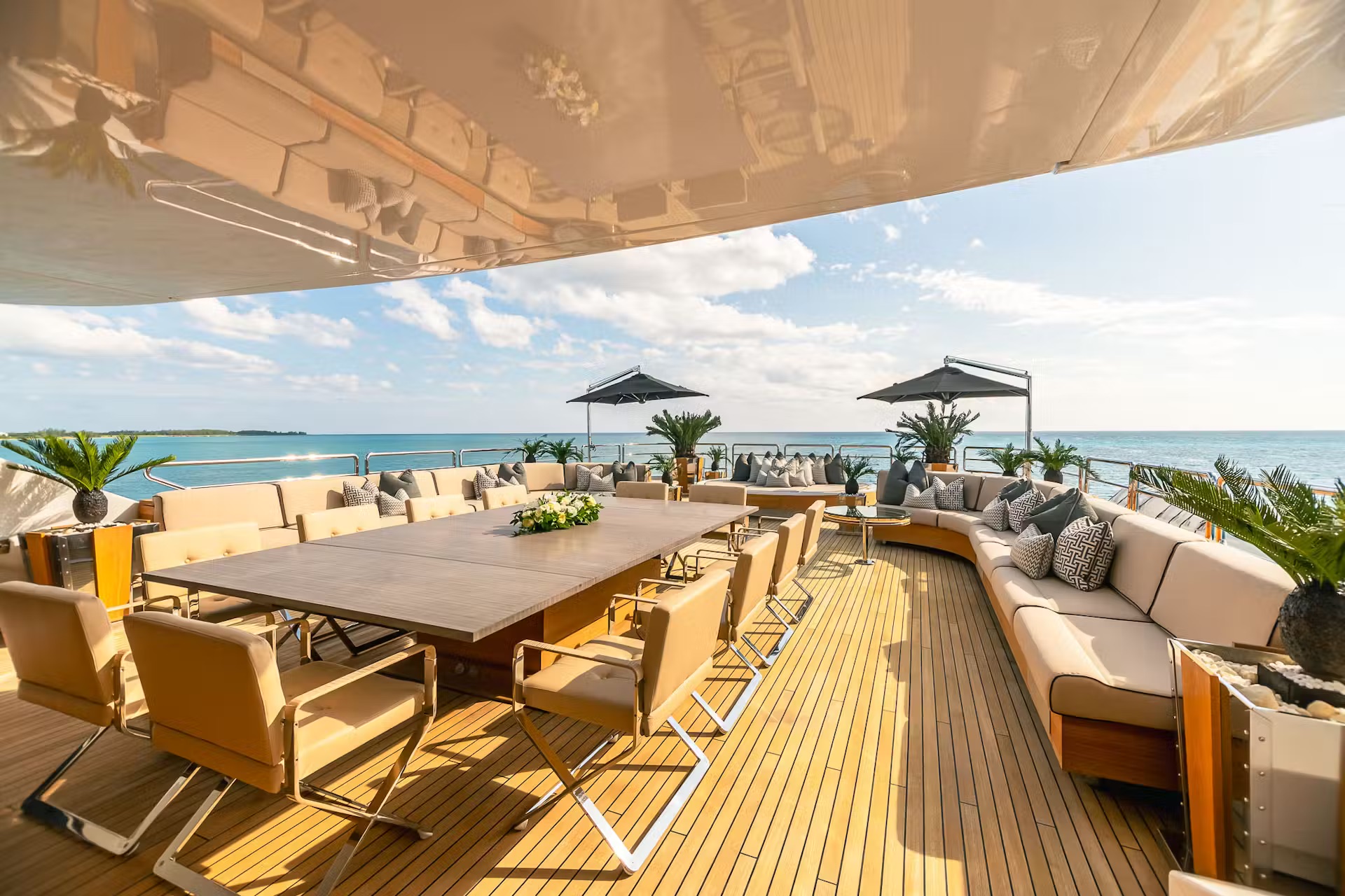 Expansive sundeck with alfresco dining table and ocean views