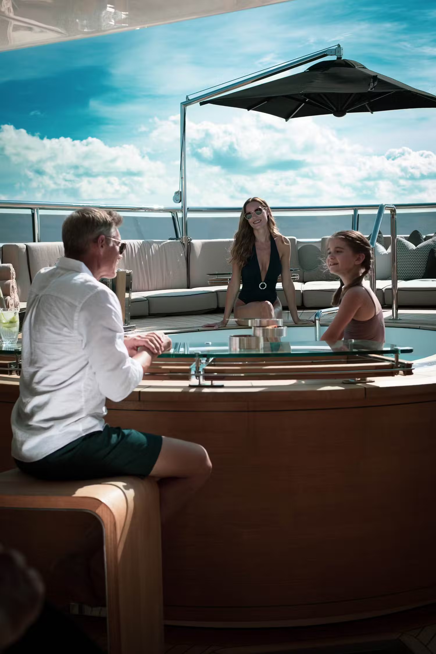 Sealion superyacht anchored in crystalline turquoise tropical waters with clear skies.