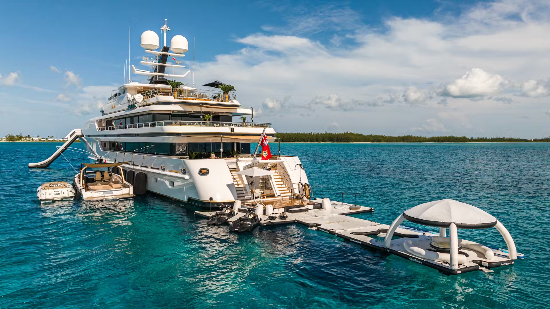 Sealion superyacht anchored in turquoise Caribbean waters with deployed tenders