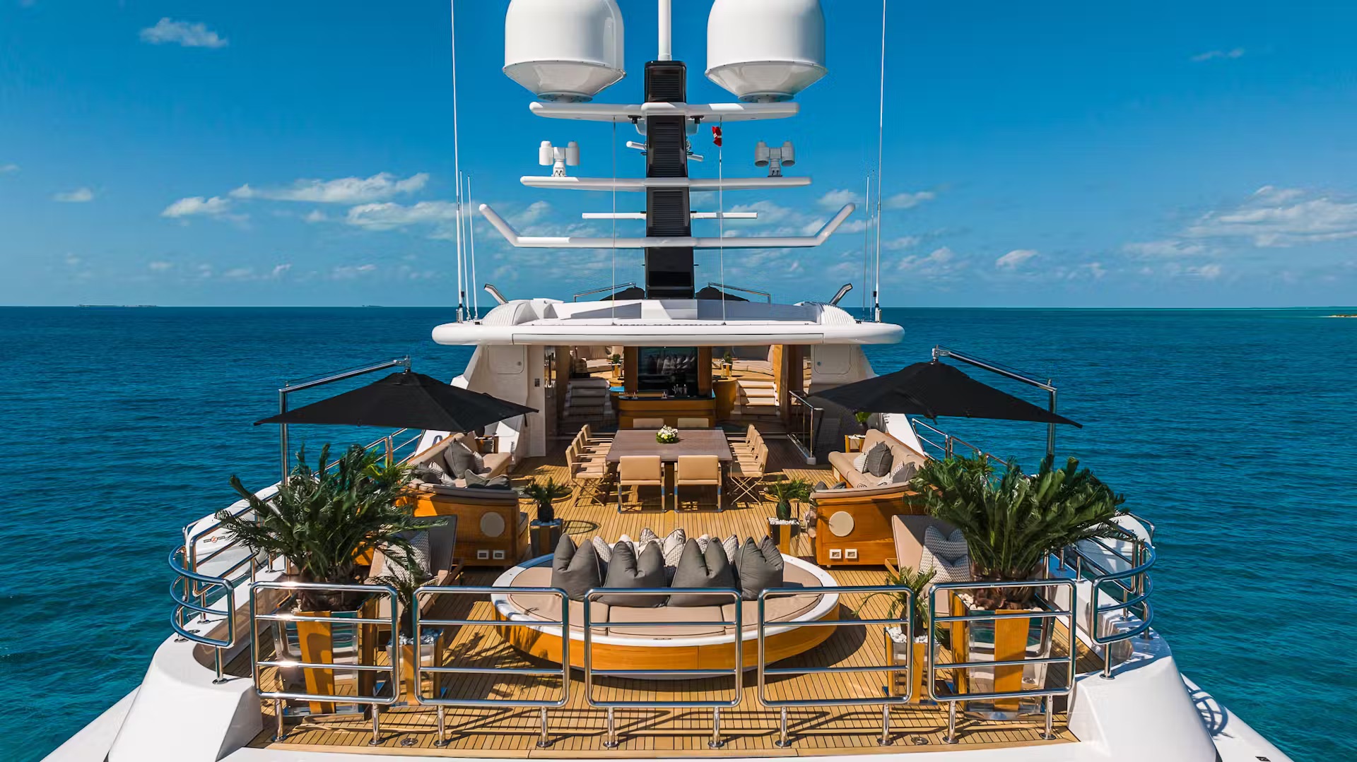 Full-length aerial view of Sealion showing multiple decks and exterior teak styling